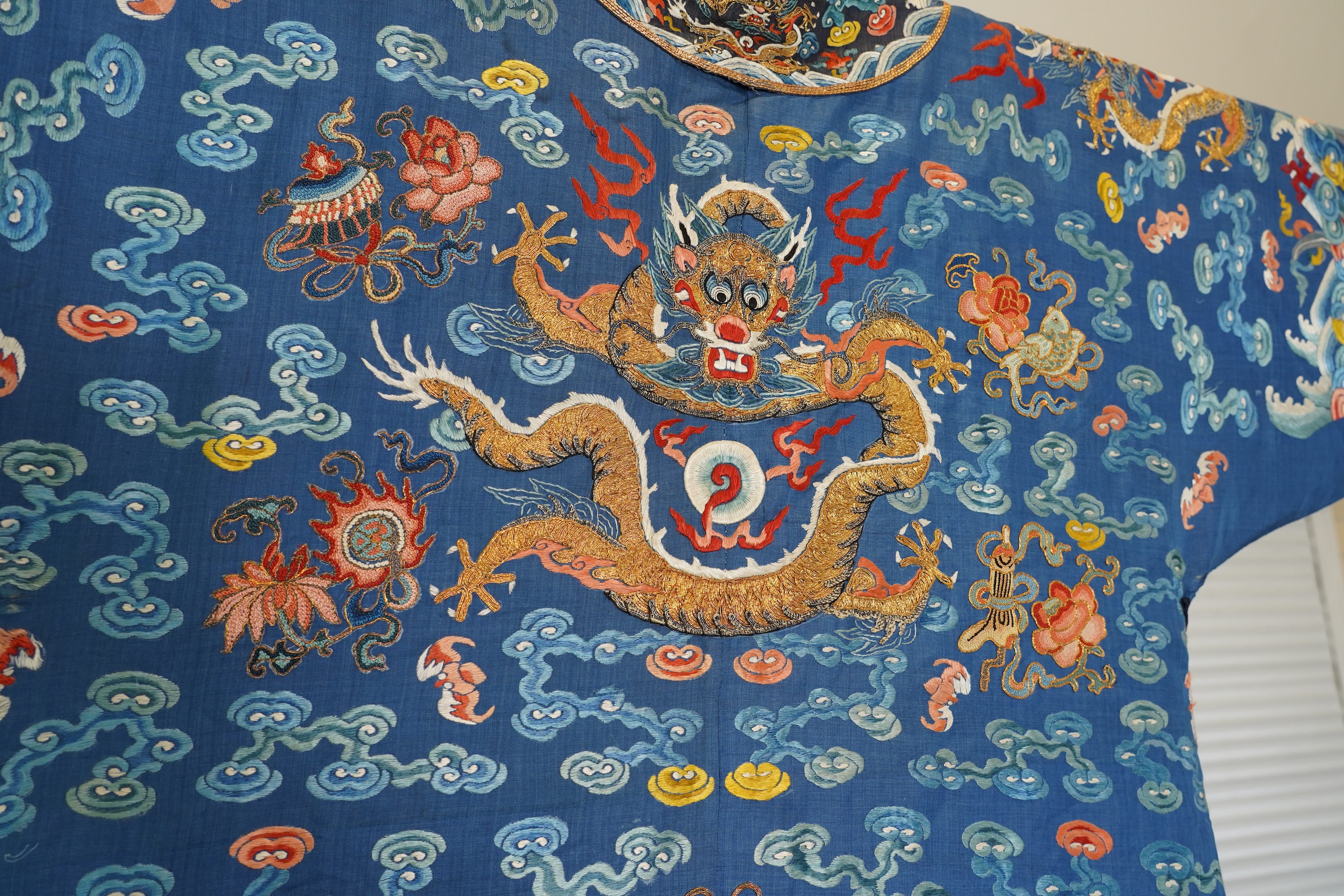 A Chinese blue silk man’s dragon robe, jifu, 19th century